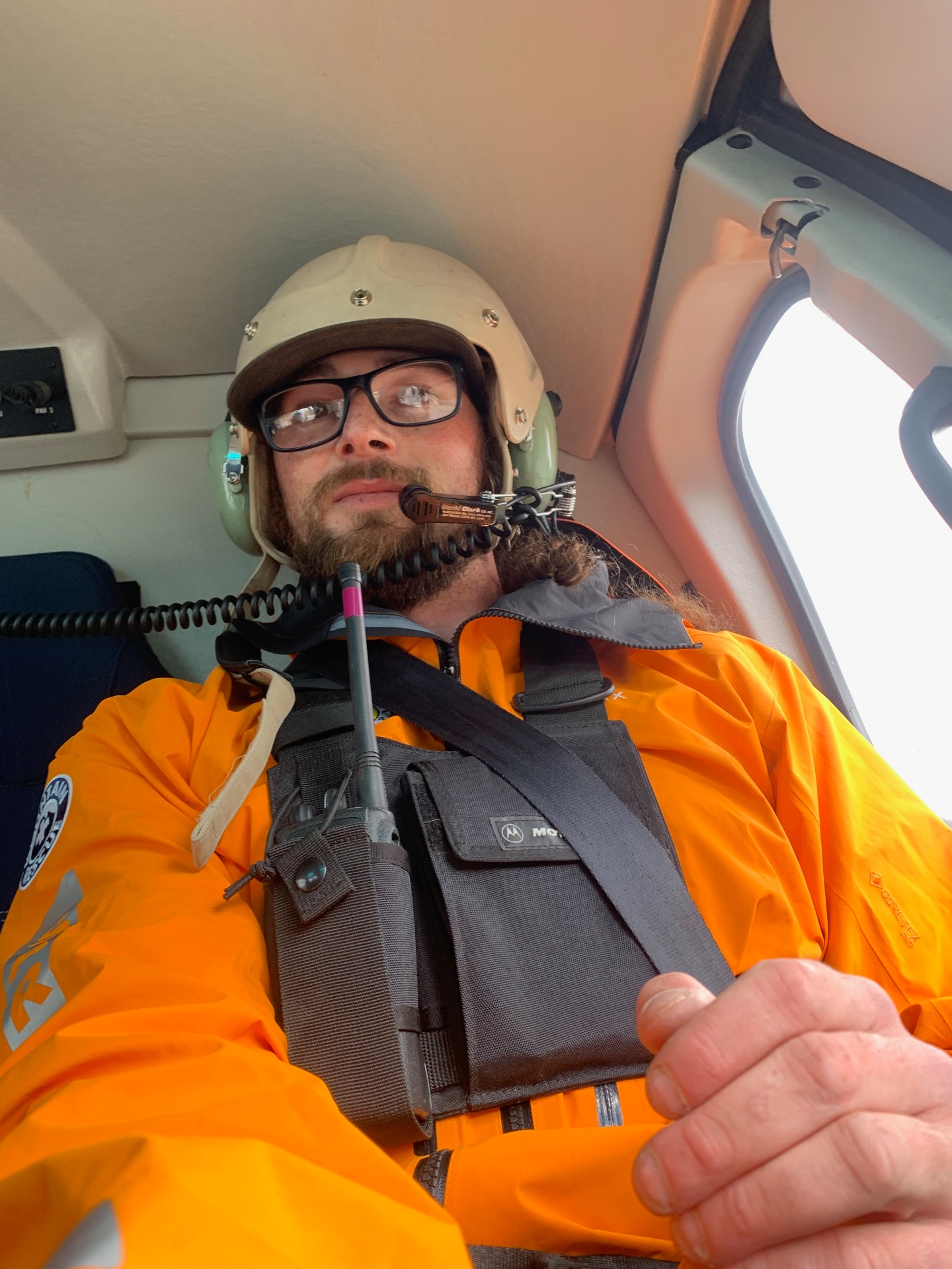 Kai in a helicopter during remote Alaska field work